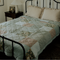 green patterned quilt