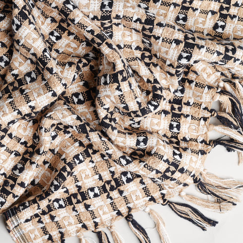 beige and black diamond patterned throw blanket