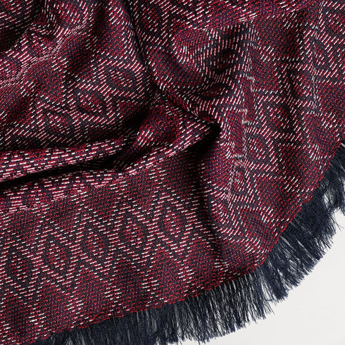 geometric pattern throw marron blanket displaying its unique pattern and texture