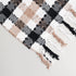 white brown and black, throw blanket corner image displaying check/plaid pattern