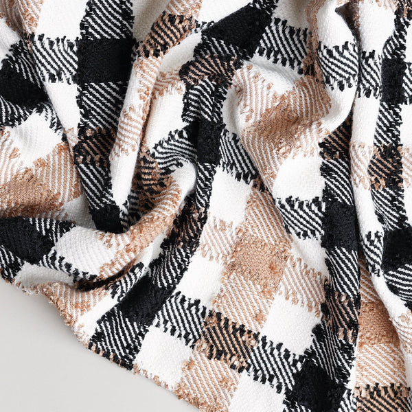 beige, black, and white throw blanket close up to show detailed patten and colors