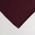 corner image of maroon colored soft throw blanket