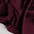 soft maroon colored throw blanket with hemmed edges