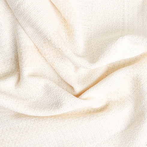 textured ecru and light beige cream colored throw blanket showing striped pattern and texture
