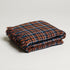 multicolor blue and orange plaid throw blanket with fringe