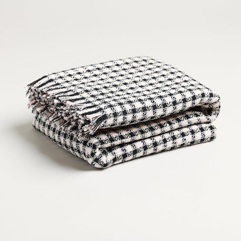 black and white plaid check throw blanket folded up 69 inches long