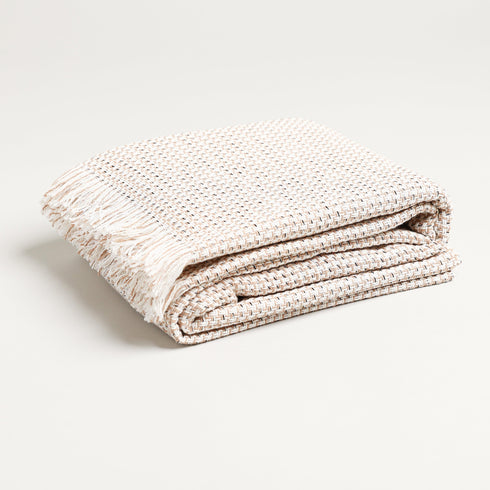 folded fall plaid throw blanket made from a cotton blend