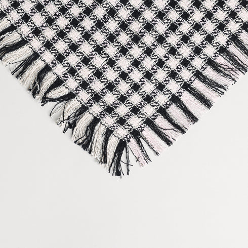 black and white fringe throw blanket with a check plaid pattern