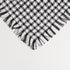black and white fringe throw blanket with a check plaid pattern