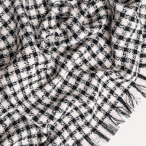 black and white check throw blanket close up to display pattern and unique texture