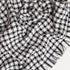 black and white check throw blanket close up to display pattern and unique texture