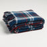 A picture of our green, navy and red chunky plaid throw blanket