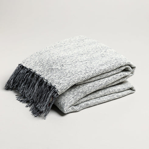 grey herringbone patterned white and black throw blanket