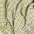 spring colored tweed fancy throw blanket twisted to show texture and pattern