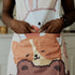 animal print apron close up
