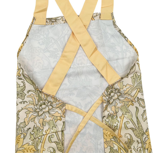 behind the yellow and green floral apron