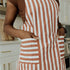 close up of red apron with white stripes