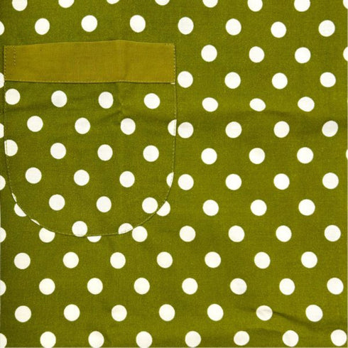close up view of green apron with white polka dots