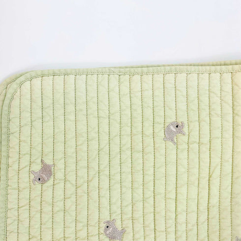 elephant on green quilt