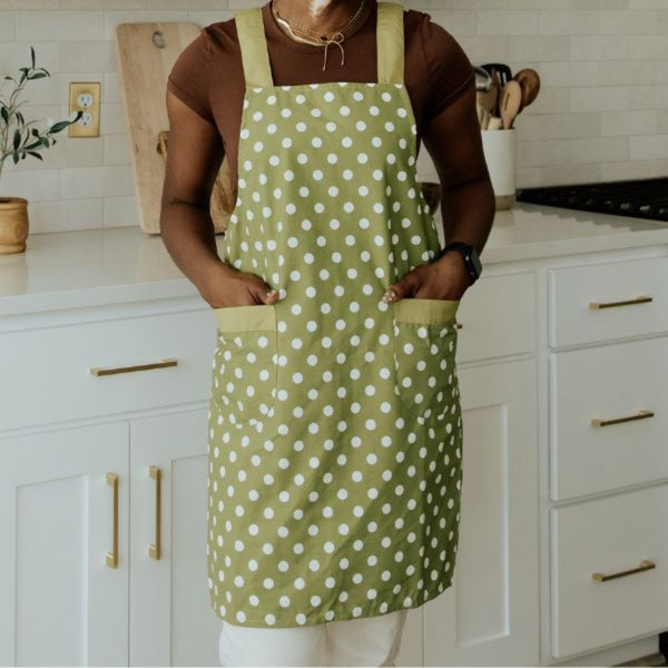 green apron with white polka dots