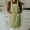 green apron with white polka dots