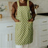 green apron with white polka dots