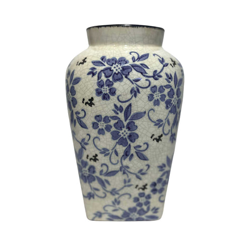 this vase has a square base and then gradually forms into a rount top