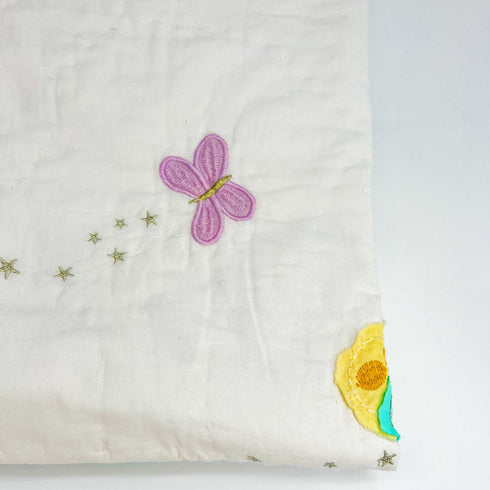 close up of purple butterfly quilt