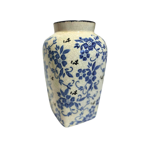 white crackled porcelain vase with decorative blue flowers on it